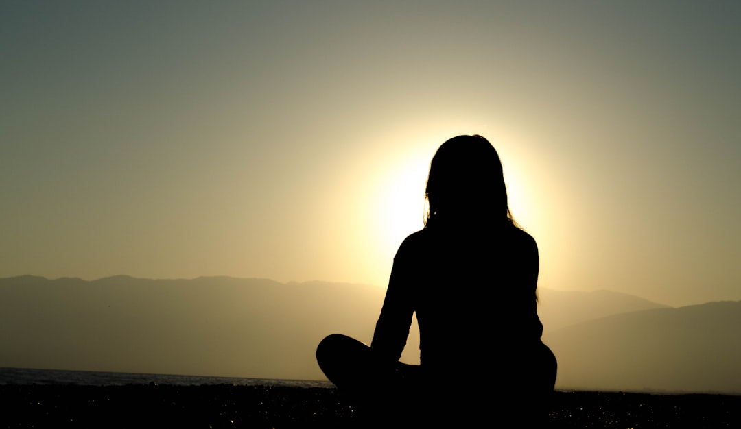 woman-sitting-on-sand-ie8ww5kux3o